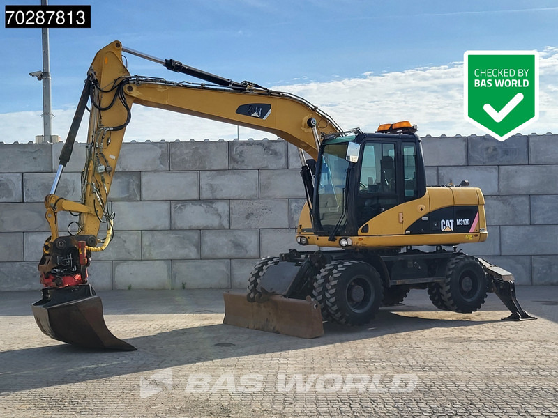 Caterpillar M313 D OUTRIGGERS + BLADE - Колісний екскаватор: фото 1 Caterpillar M313 D OUTRIGGERS + BLADE - Колісний екскаватор: фото 1
