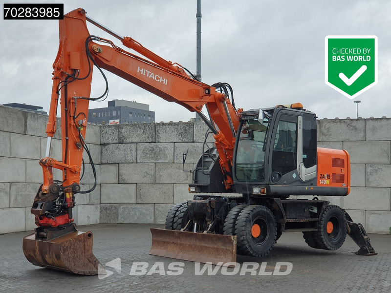 Hitachi ZX140W -3 OUTRIGGERS - ROTOTILT - Колісний екскаватор: фото 1 Hitachi ZX140W -3 OUTRIGGERS - ROTOTILT - Колісний екскаватор: фото 1