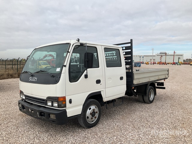 2006 Isuzu NPR77 4x2 Crew Cab Flatbed Truck - Бортова вантажівка/ Платформа: фото 1 2006 Isuzu NPR77 4x2 Crew Cab Flatbed Truck - Бортова вантажівка/ Платформа: фото 1
