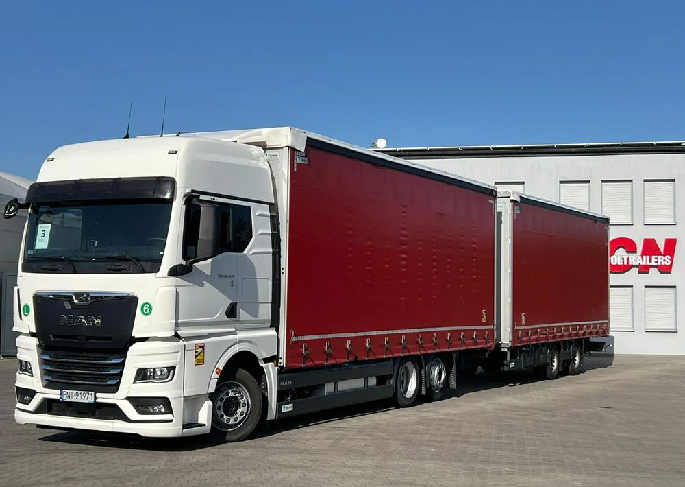 MAN TGX 26.470 z przyczepą Redos - Тентована вантажівка: фото 1 MAN TGX 26.470 z przyczepą Redos - Тентована вантажівка: фото 1