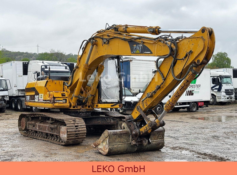 Caterpillar 318B Mit Zwei Löffeln - Гусеничний екскаватор: фото 1 Caterpillar 318B Mit Zwei Löffeln - Гусеничний екскаватор: фото 1