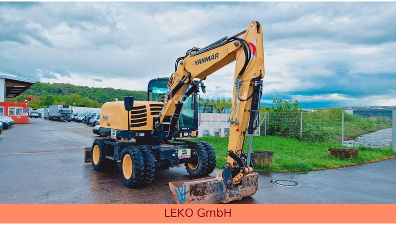 Yanmar B 95W Mit Drei Löffeln und Ein Hammer - Колісний екскаватор: фото 1 Yanmar B 95W Mit Drei Löffeln und Ein Hammer - Колісний екскаватор: фото 1