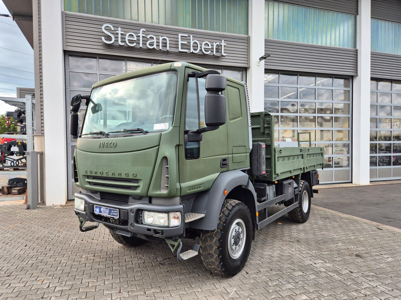Iveco Eurocargo ML100E22WM-BW 4x4 Pritsche L-Haus Bett - Бортова вантажівка/ Платформа: фото 1 Iveco Eurocargo ML100E22WM-BW 4x4 Pritsche L-Haus Bett - Бортова вантажівка/ Платформа: фото 1