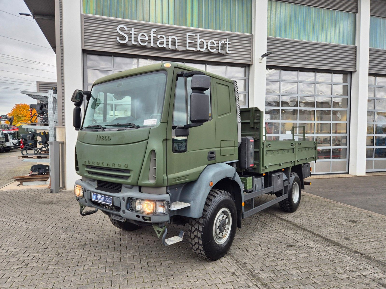 Iveco Eurocargo ML100E22WM-BW 4x4 Pritsche L-Haus Bett - Бортова вантажівка/ Платформа: фото 1 Iveco Eurocargo ML100E22WM-BW 4x4 Pritsche L-Haus Bett - Бортова вантажівка/ Платформа: фото 1